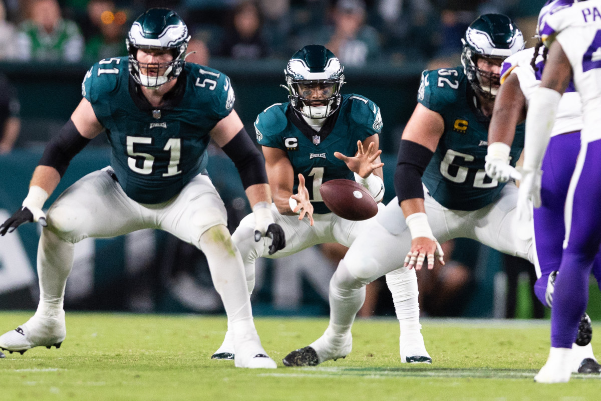 Jalen Hurts catches the snap behind Jason Kelce and Cam Jurgens
